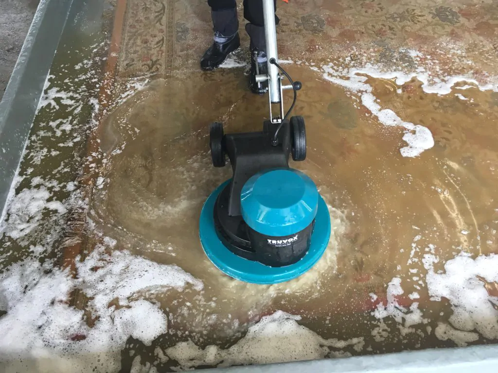 Rug being cleaned